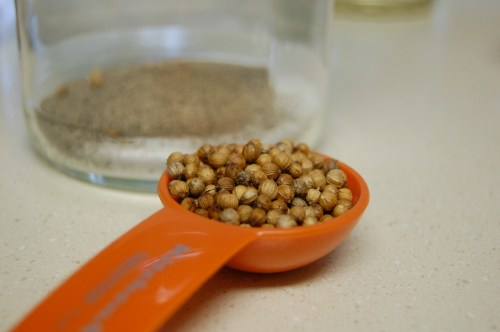 coriander seeds in measuring spoon