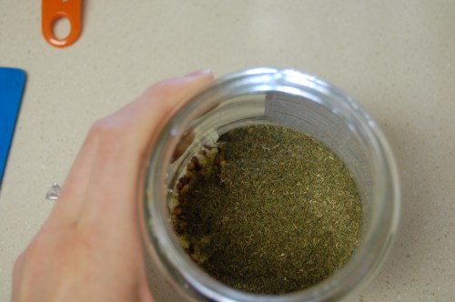 pickle jar with dill, garlic, coriander, salt and pepper