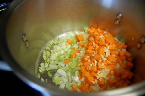 Vegetables in pot Soup vegetables in pot - carrots, onions, celery, garlic, olive oil