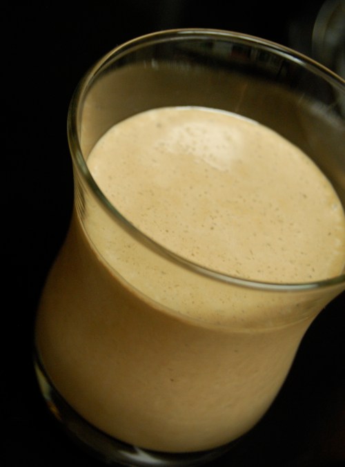 Frozen drink chocolate peanut butter milkshake in a glass