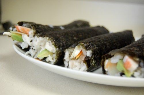 4 sushi rolls on a plate