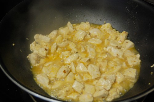 Chopped chicken simmering in juices