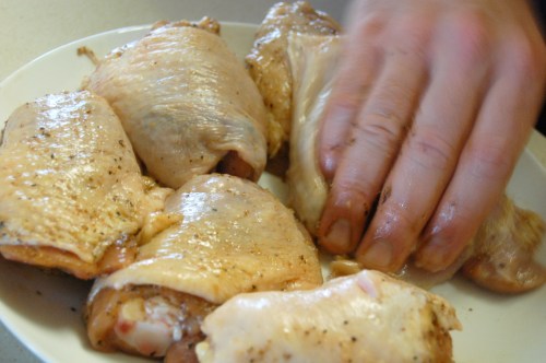 Stephen seasoning raw chicken thighs